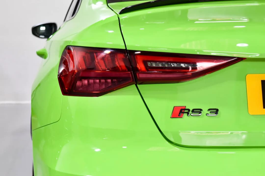 Close-up detail of a Kyalami Green Audi RS3 Sportback ready for handover at East Midland Cars showroom