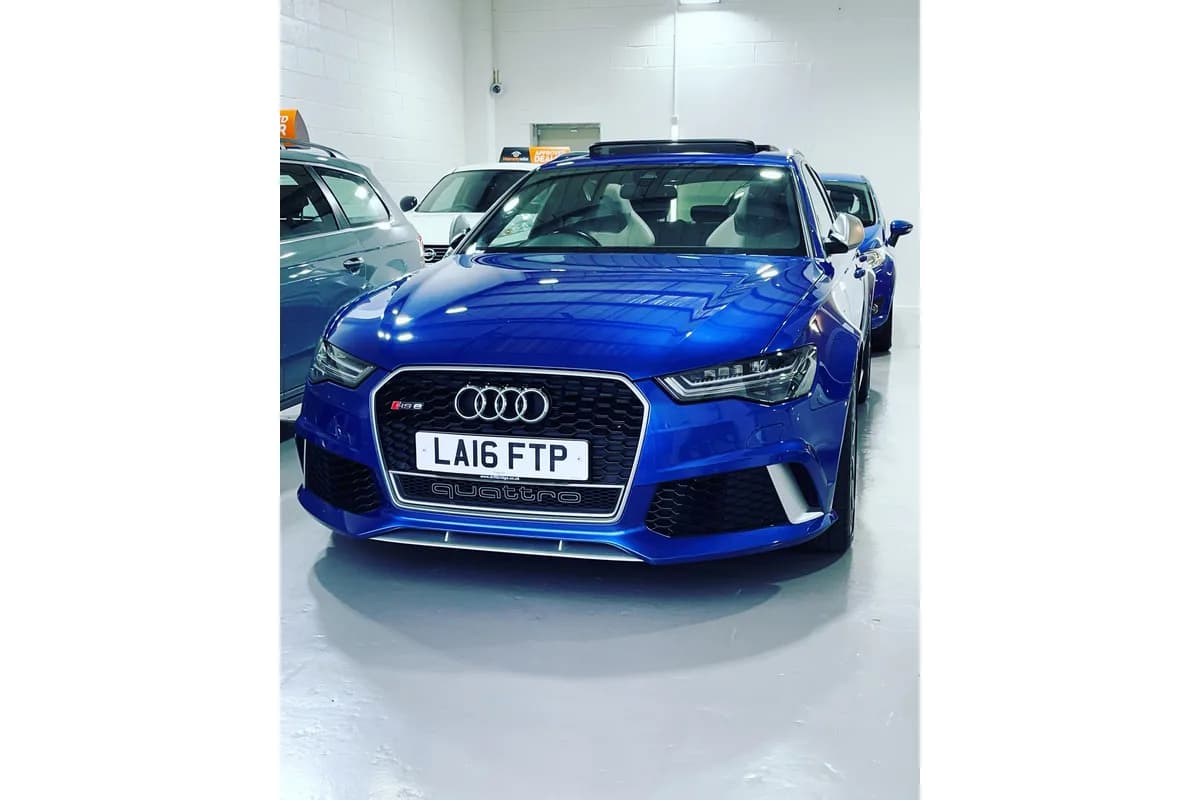 Blue Audi RS6 Avant Quattro parked inside the East Midland Cars Leicester showroom